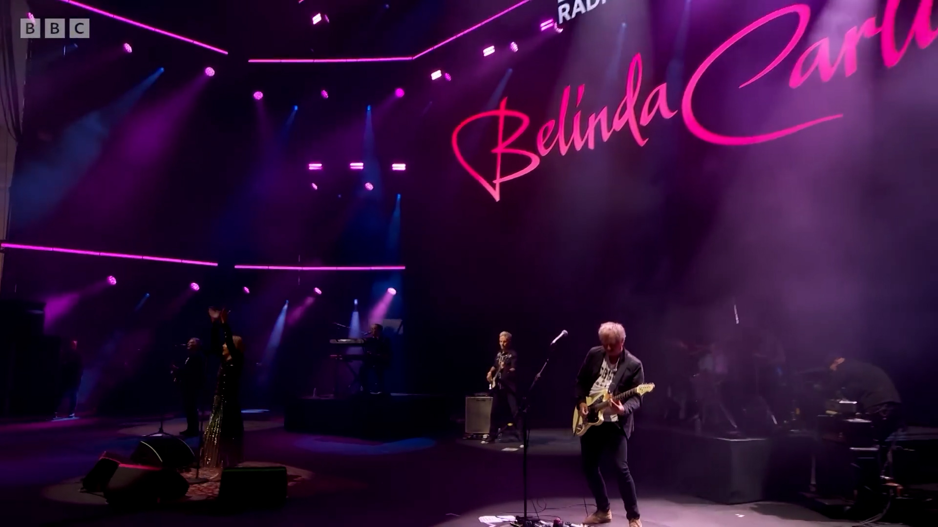 James Nisbet on stage with Belinda Carlisle — BBC